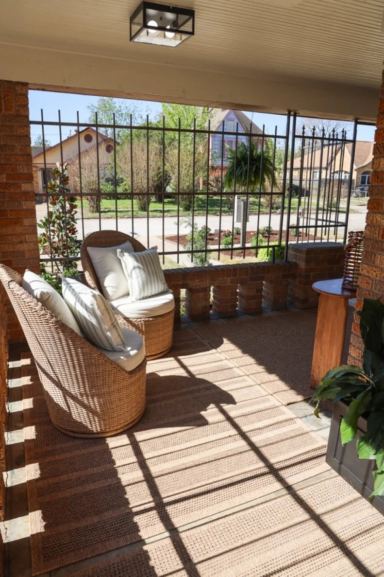 a freshly transformed covered porch with new seating in Houston
