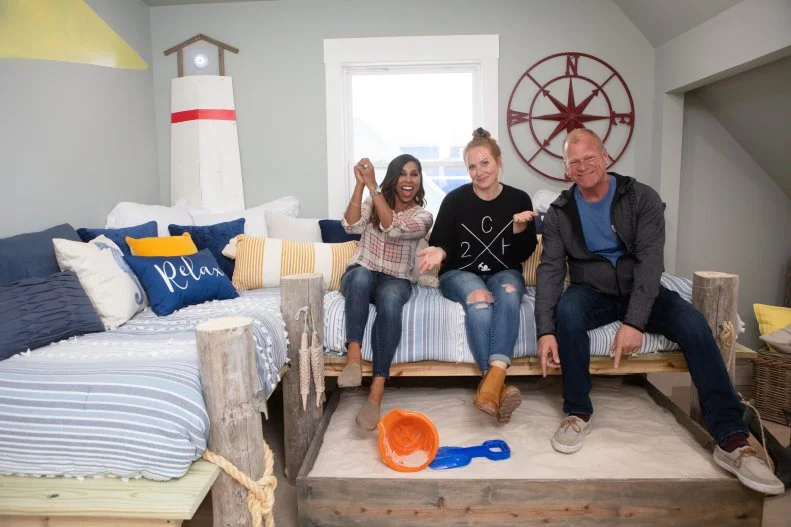 As seen on HGTV's Battle on the Beach, mentor Taniya Nayak poses with judges Mina Starsiak Hawk and Mike Holmes in the redesigned kids' room created by her team. This nautical design featured a boat bed, sandbox and dock inspired platform beds.  (Talent)