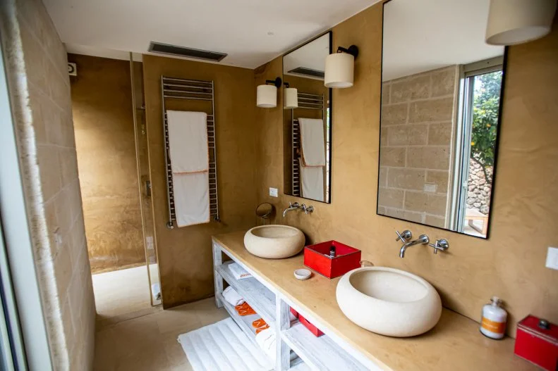 Interior shot of bathroom in Masseria Mongiò during Chef Gabriele Bertaccini's property tour, as seen on House Hunters International, Season 194.