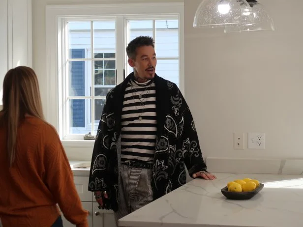 HOST DAVID BROMSTAD ADMIRING THE KITCHEN OF HOUSE #2, BASS PLACE 