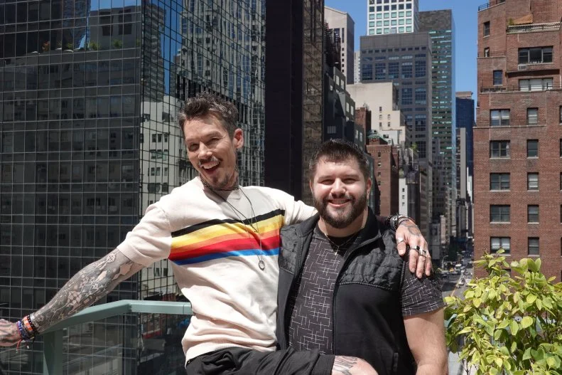 HOST DAVID BROMSTAD (LEFT) POSES FOR A PICTURE WITH LOTTERY WINNER STEPHEN DEIRO (RIGHT) ON THE BALCONY OF HOUSE 2, PENMAR PLACE, HERO 