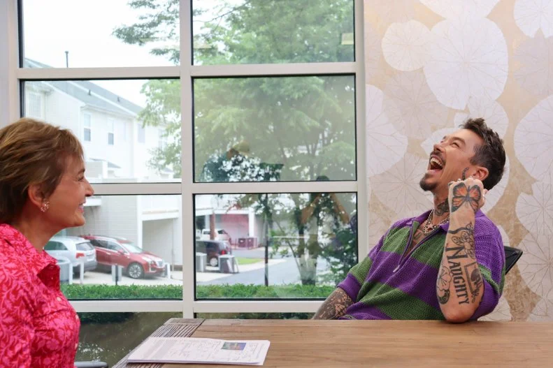 Host David Bromstad (right) meets with local agent Cindy Crisp (left) to go over listings in the area, as seen on My Lottery Dream Home, Season 18.