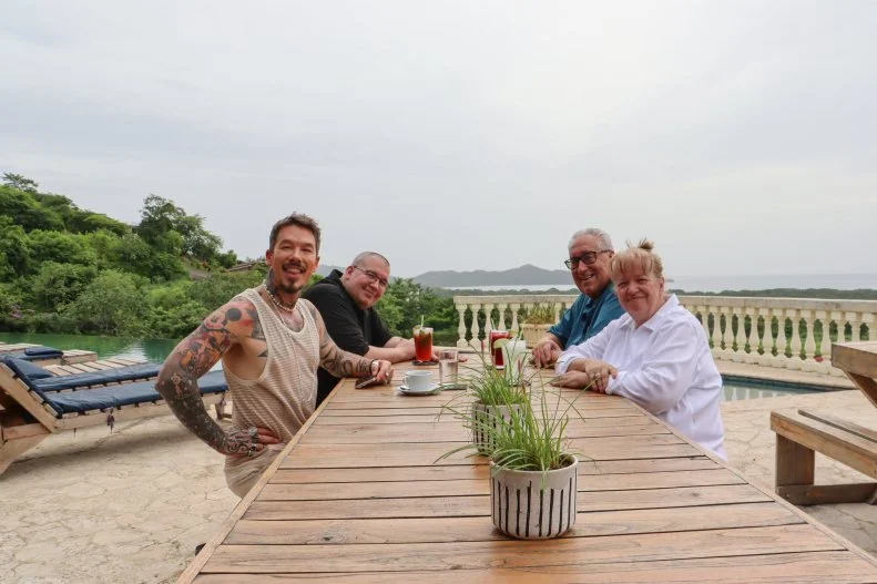 From left to right: Host David Bromstad, Jason Kerin, Tim Kerin, and Tracey Kerin pose for a photo after discussing the properties they toured together, as seen on My Lottery Dream Home, Season 18.