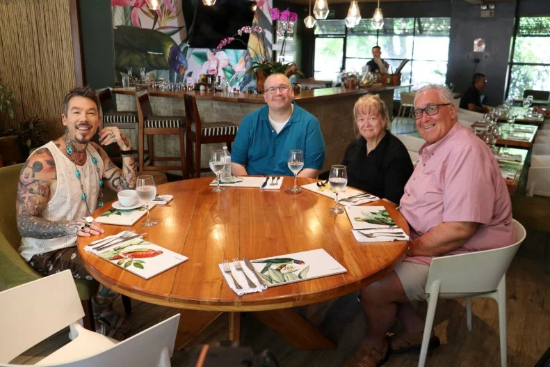 From left to right: Host David Bromstad, Jason Kerin, Tracey Kerin, and Tim Kerin meet to go over what they are looking for in their dream home, as seen on My Lottery Dream Home, Season 18.