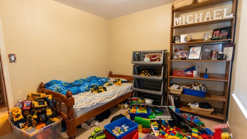 Michael's room pays tribute to his hero Mike Holmes, but he needs some organization, and something with the Holmes touch.