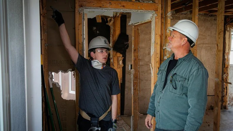 Michael points out a concern regarding the window framing to Mike.