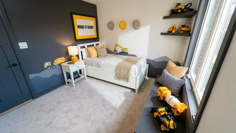 Michael's bedroom has been updated with new storage, automated windows, and a Make It Right Mike Holmes construction theme.