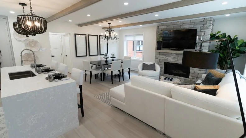 Mike and Janetta's home is entirely changed. With the new open floorplan, everyone can gather without the kitchen being cut off from the dining and living room.