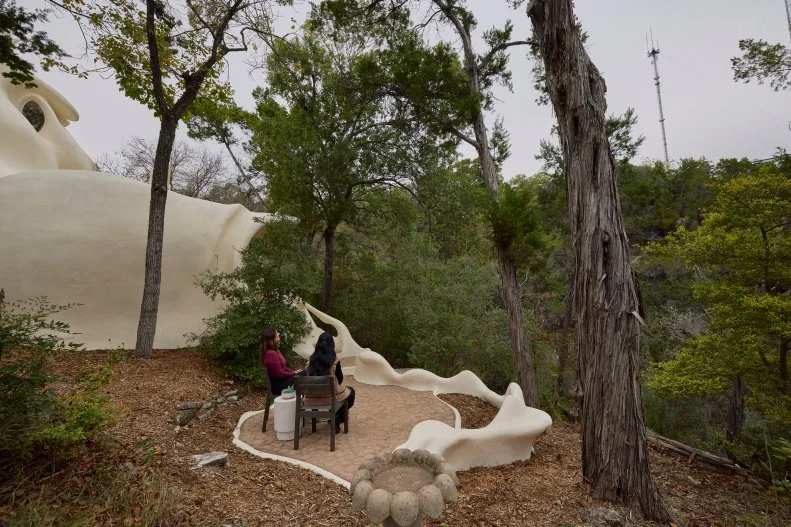 Host Sherry Cola and D’Arcy Carden at the Exterior of the Bloomhouse, as seen on Wild Vacation Rentals, Season 1.