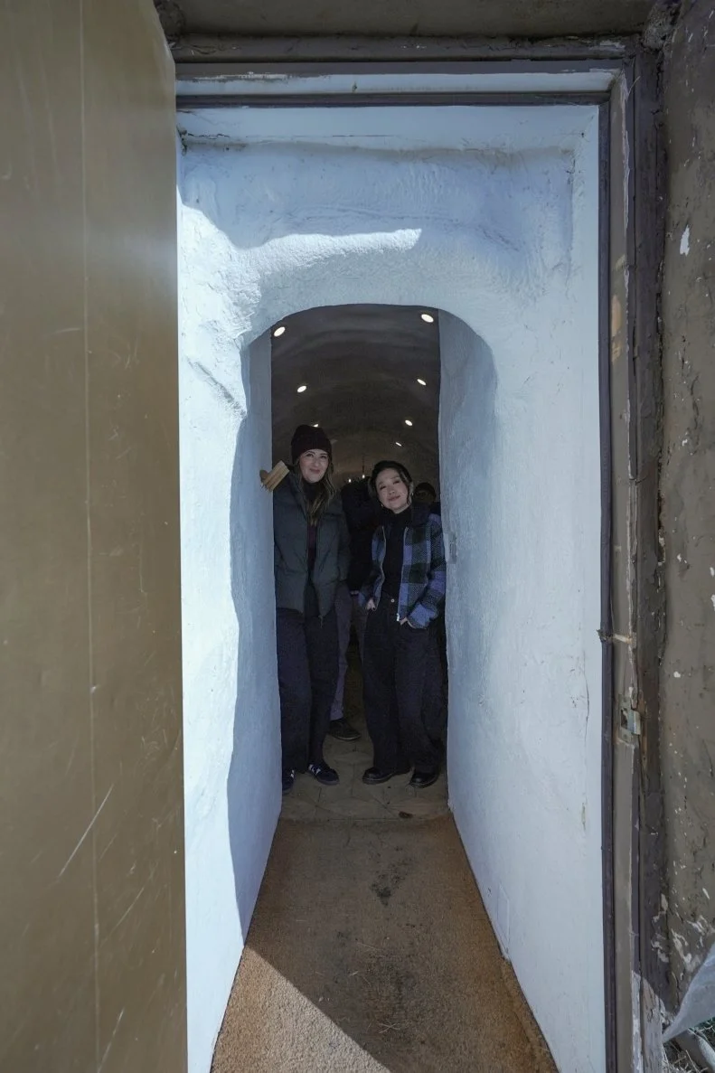 D'Arcy Carden and Sherry Cola portrait standing inside the Big Idaho Potato Hotel entrance, as seen on WVR S1