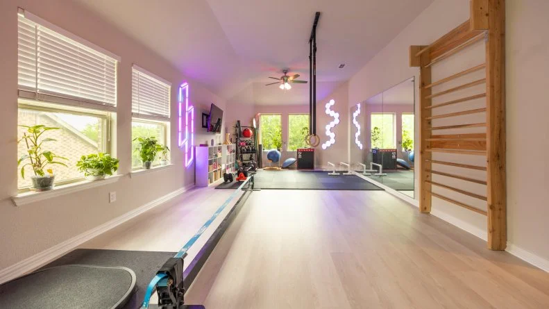 Fitness room in client's Mark and Anastasia's home, as seen on Extreme Buyers Club Season 1