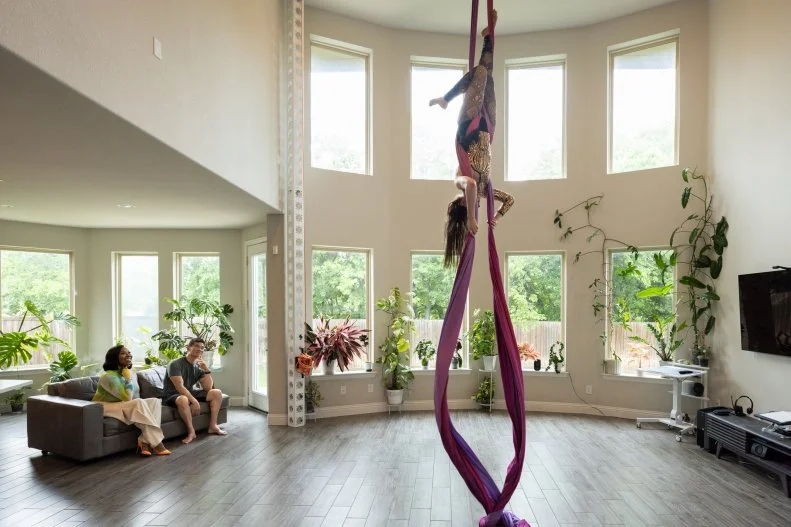 Client Anastasia practicing her aerial silks at home, as seen on Extreme Buyers Club Season 1