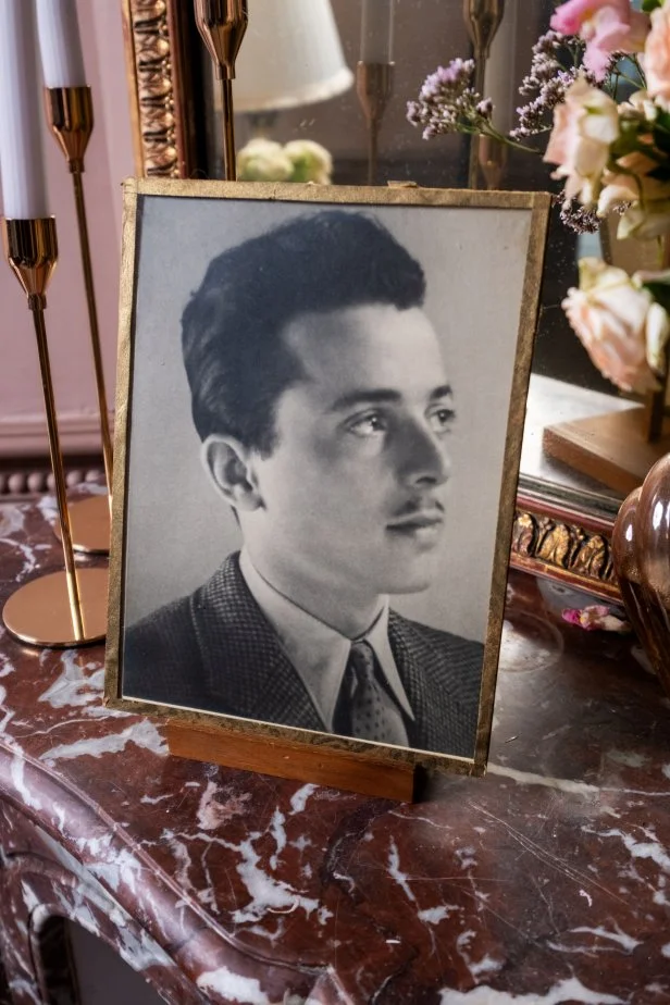 This is a photo of Daphne Reckert's grandfather in the redone bureau (office) in Chateau de Lesigny, in Lesigny France. Talent Daphne Reckert Reckert and Ian Figueira Figueira are renovating the chateau which was handed down to Daphne Reckert by her grandfather, as seen on Castle Impossible, Season 1.