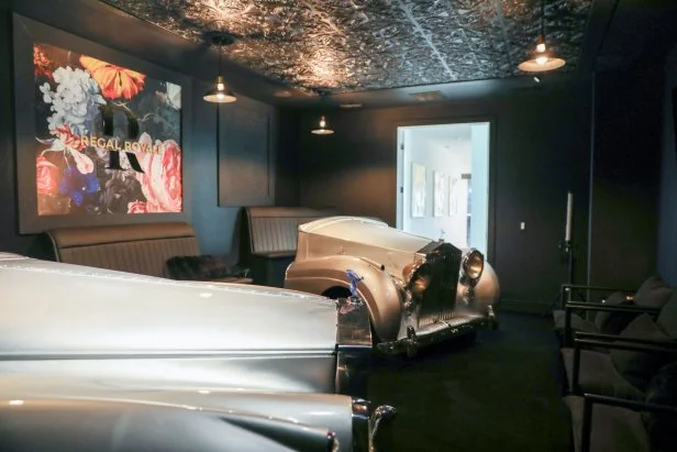 Two car hoods in room in the Regal Royale, as seen on Zillow Gone Wild, Season 3.