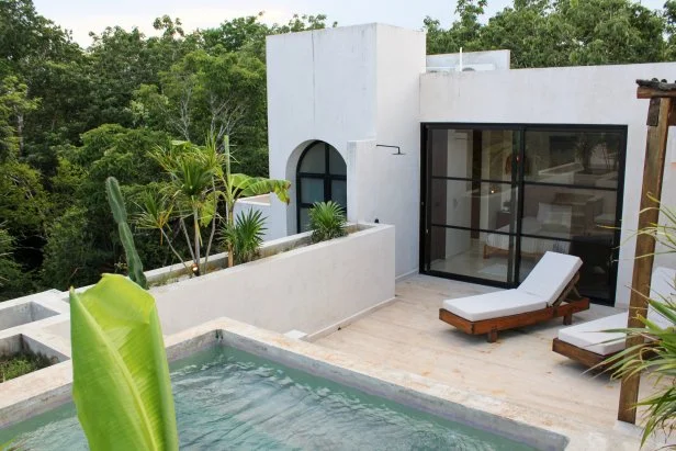 Exterior shot of roof deck in luxury condo during Akhil Patel and Amy Leong's house tour, as seen on Tropic Like It's Hot, Season 1.