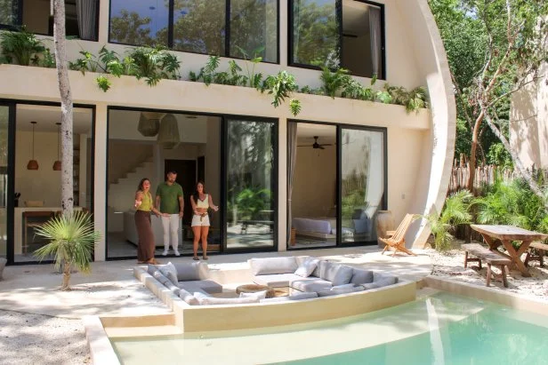Agent Lev Makievsky and contributors Gabby Tomasello and Megan Weintraub during their house tour, as seen on Tropic Like It's Hot, Season 1.