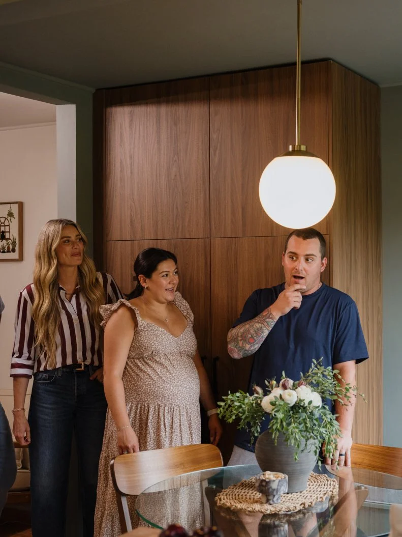 Host, Arielle Vandenberg, and Steve Lewis, Contractor, and homeowners Melissa and Russ Rivas- Marden reveal, as seen on House Shock, Season 1