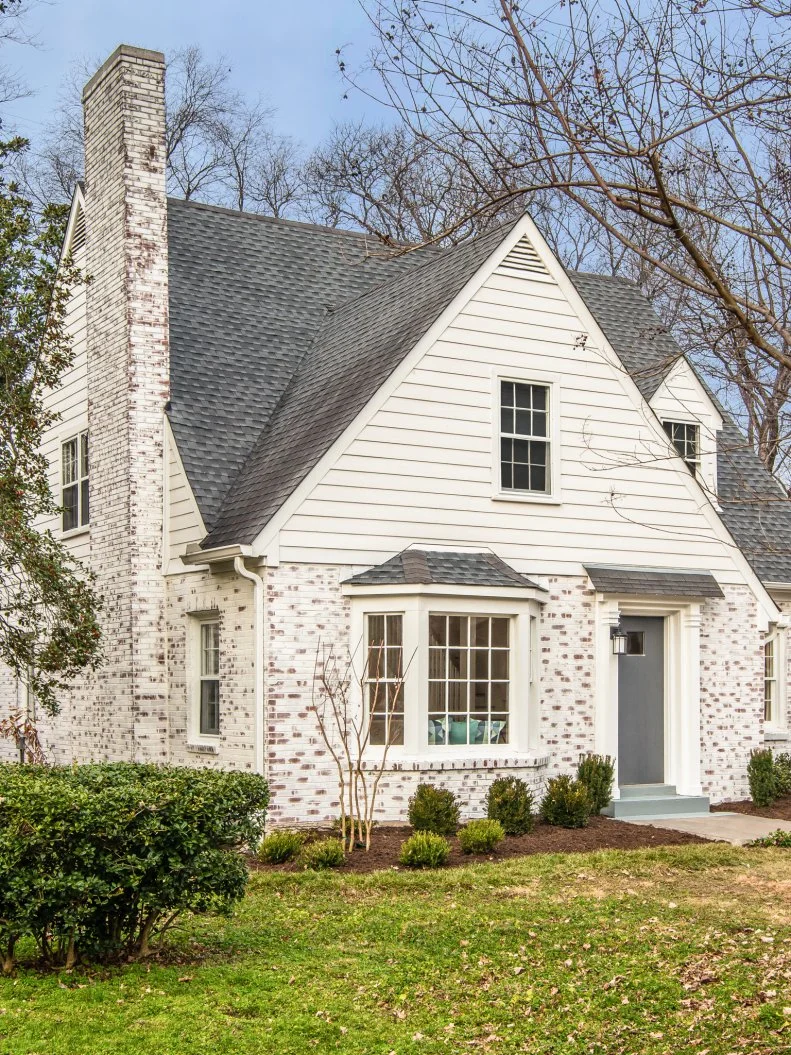 A limewash brick treatment, a bit of landscaping and a fresh coat of front door paint will blow short term renters away when they pull up to Rhonda's renovated Nashville home, as seen on My House Is Your House. AFTER #3  (after, exterior)