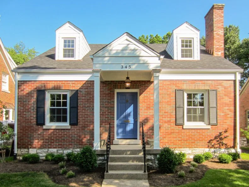 This cape cod style home in Lexington, KY has great curb appeal with the red brick, white columns and nice size yard, featured on HGTV's House Hunters.