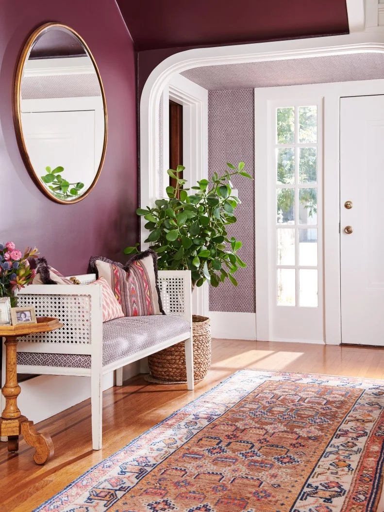 Plum Entry With a Bench and Colorful Rug