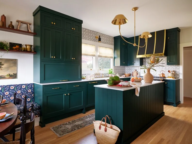 Green Kitchen With an Island and Patterned Tile