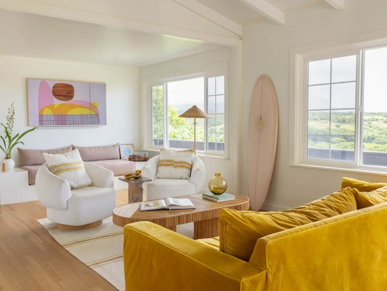 HGTV Magazine shares the details of this laidback, neutral living room with yellow and pink accents.