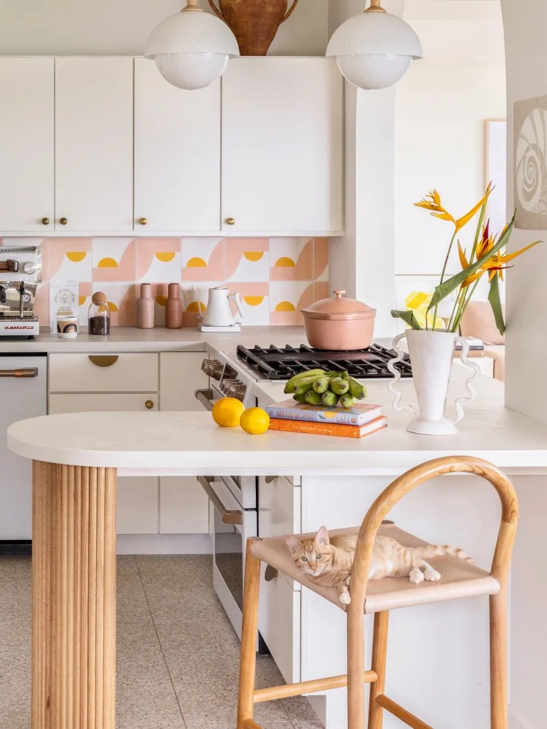 White Kitchen With Pink and Yellow Backsplash Tiles