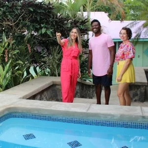 Agent Alexandra Amador and contributors Hannah and Victor Sine during their house tour, as seen on Tropic Like It's Hot, Season 1.