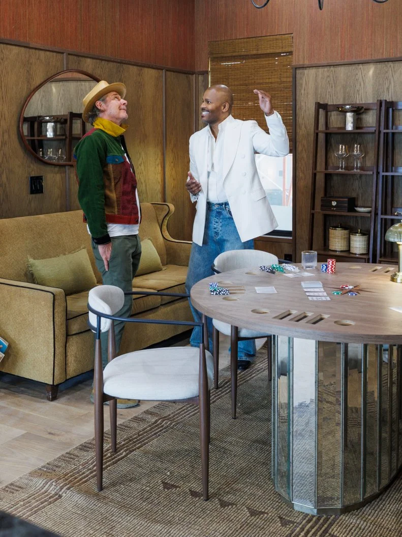 Host Ty Pennington joins Guest Judge Michel Smith Boyd in reviewing Team Kim Wolfe and Chelsea Meissner's Great Room - Den, as seen on Rock the Block, Season 7.