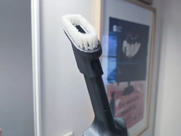 A narrow head on a handheld vacuum.