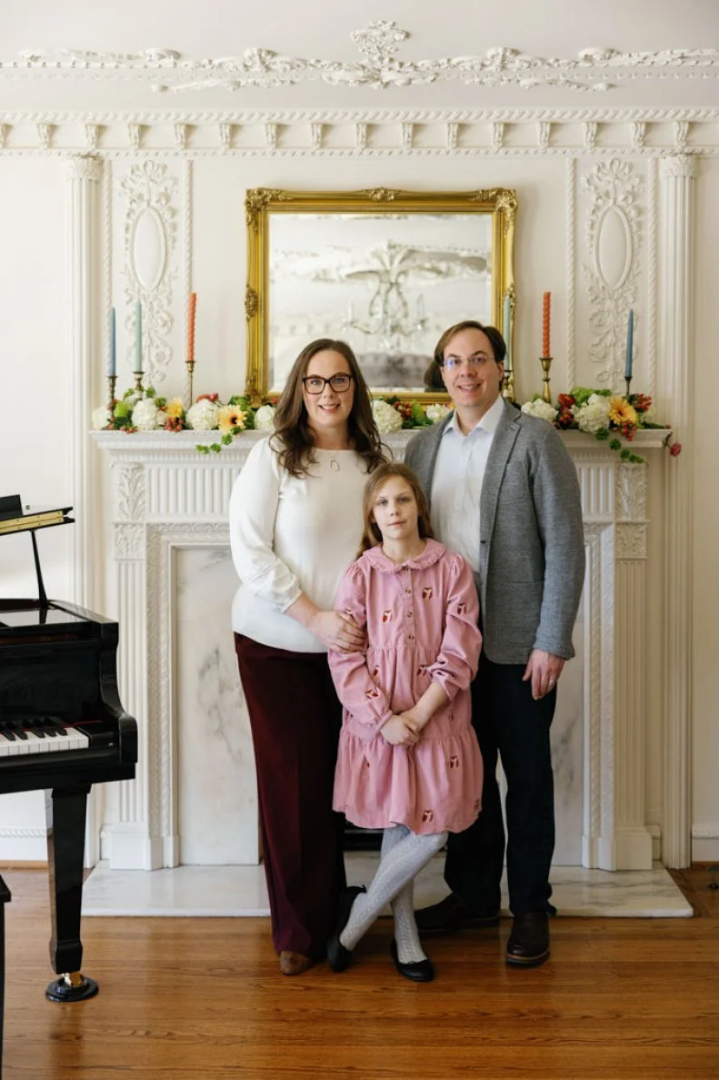 Homeowners  Jonathan and Lindsey Ciechanowski and their daughter in their stunning living room.