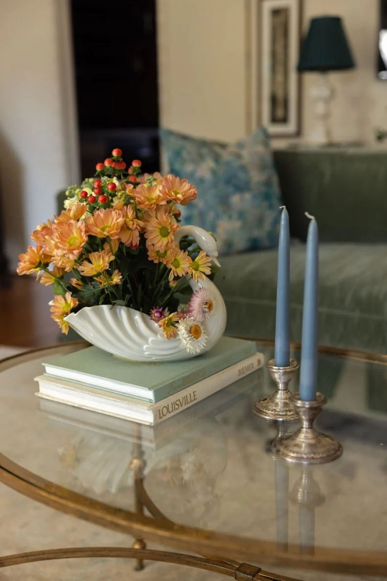 Heirloom objects and a restful palette of blues and greens against white walls gives this Louisville, Kentucky home an elegant, relaxing attitude.