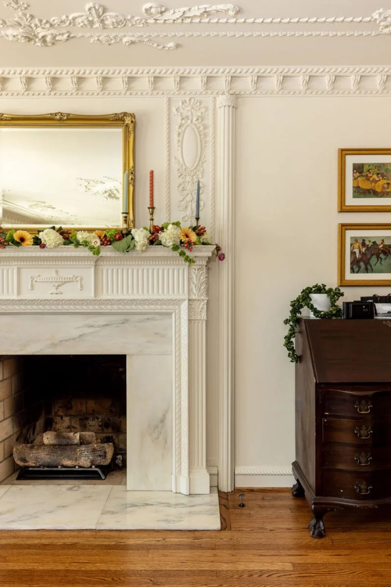Though constructed in the 1960s, a previous owner embellished this townhouse with a delightful excess of wedding cake crown molding that designer Gretchen Rose decided to embrace in her vision for the home.