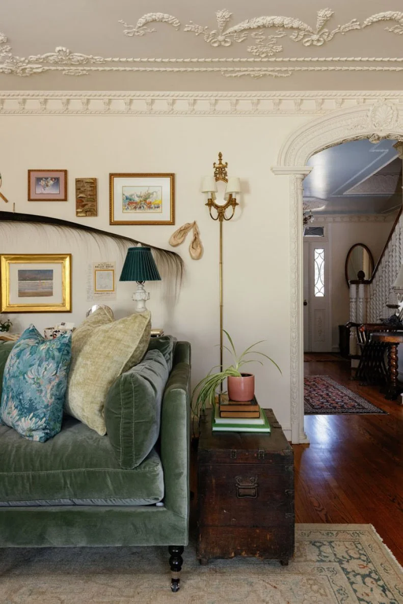 The refined attention to detail continues in the opening hallway seen in the distance with its ornately carved banister.