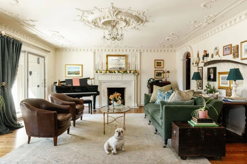 Filled with family heirlooms and ornamented with some stunning molding, this living room has an old world feel.