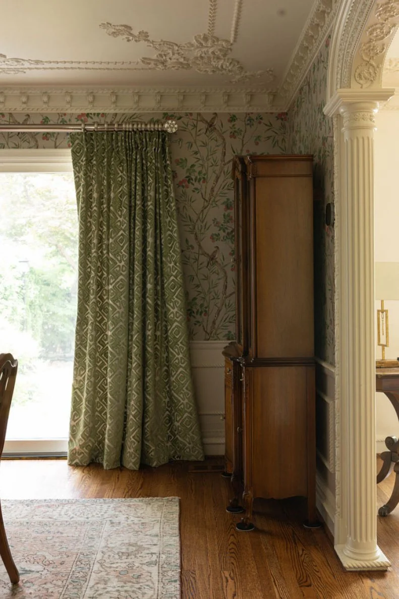 Details count and the beautiful graphic pattern on these curtains intensify the elegance of this traditional dining room.