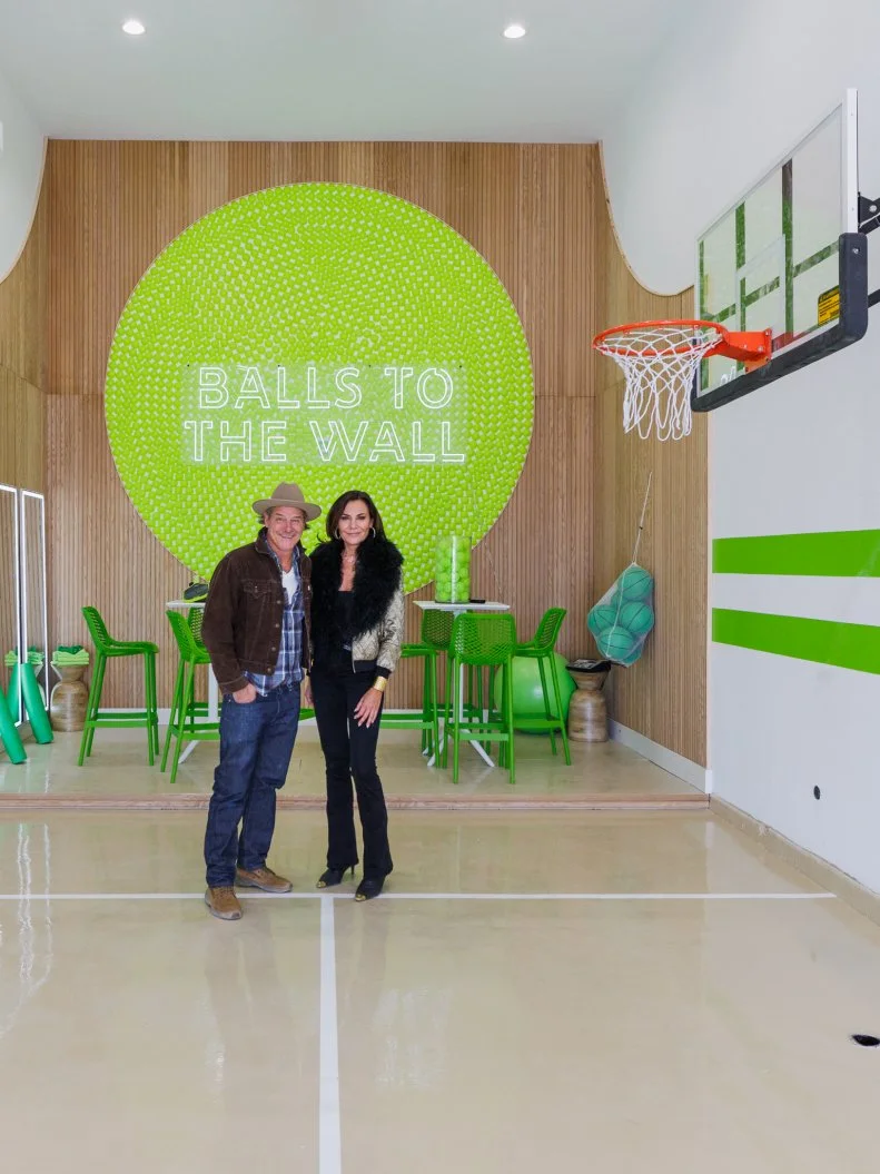 Host Ty Pennington and Guest Judge Luann de Lesseps review Team Scott McGillivray and Brooke Hogan's RV Garage, portrait, as seen on Rock the Block, Season 7.