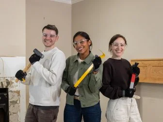 Mentor Mika Kleinschmidt and her team of Anna and Josiah Julian work on demoing the living room, as seen on Battle on the Beach, Season 5.