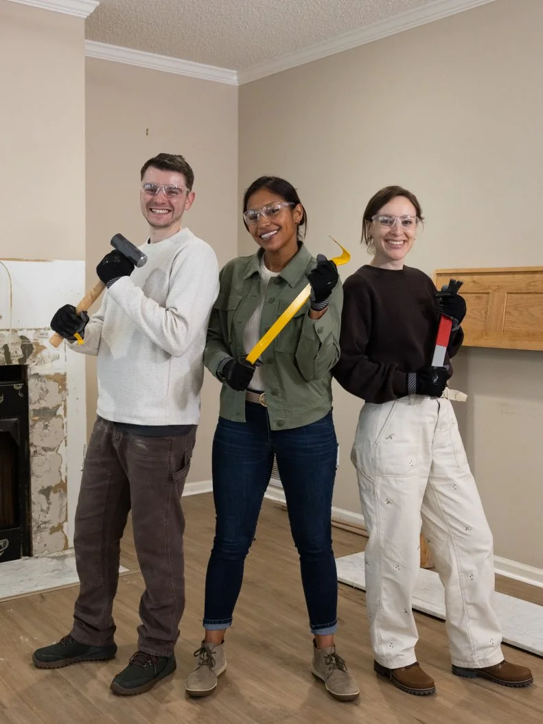 Mentor Mika Kleinschmidt and her team of Anna and Josiah Julian work on demoing the living room, as seen on Battle on the Beach, Season 5.