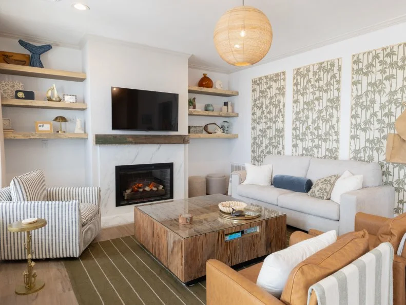 After of Team Mika Kleinschmidt’s living room renovation that included a new fireplace and floating shelves, as seen on Battle on the Beach, Season 5.