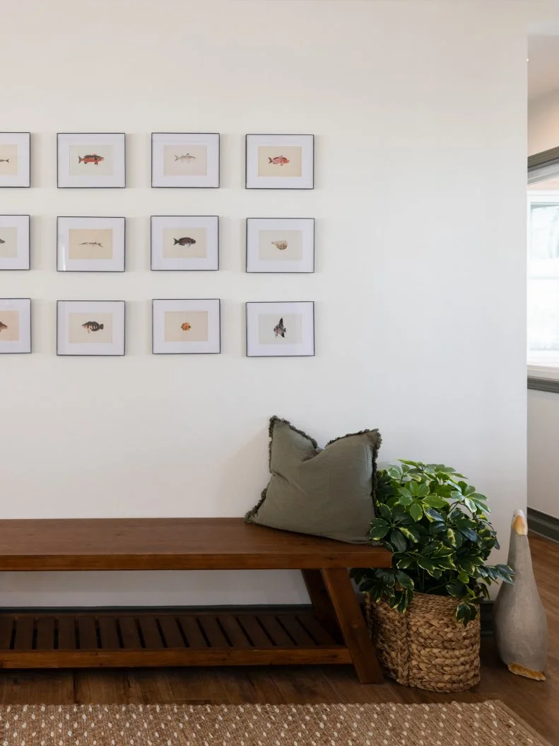 After of Team Mika Ty Pennington’s living room renovation that included a reimaged entryway, as seen on Battle on the Beach, Season 5.