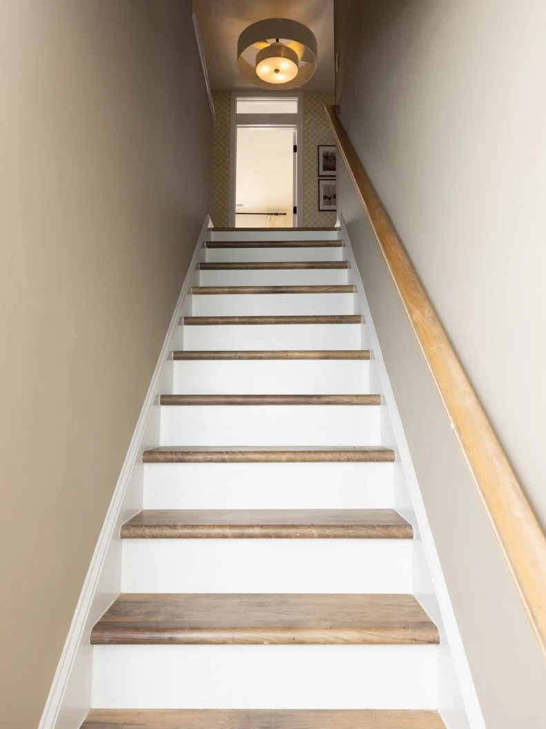 After of Team Mika Ty Pennington’s living room renovation that included revamped staircase, as seen on Battle on the Beach, Season 5.