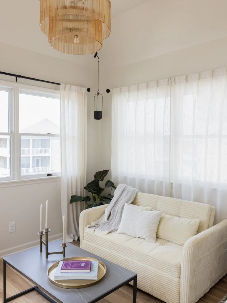 After of Team Sarah Baeumler’s guest bedroom from the partner swap challenge with a hidden closet and sitting area, as seen on Battle on the Beach, Season 5.