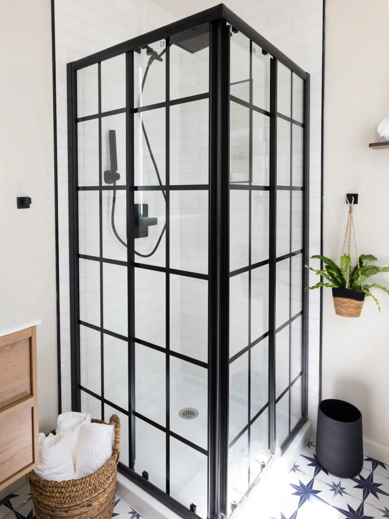 After of Team Sarah Baeumler’s modern guest bathroom renovation, as seen on Battle on the Beach, Season 5.