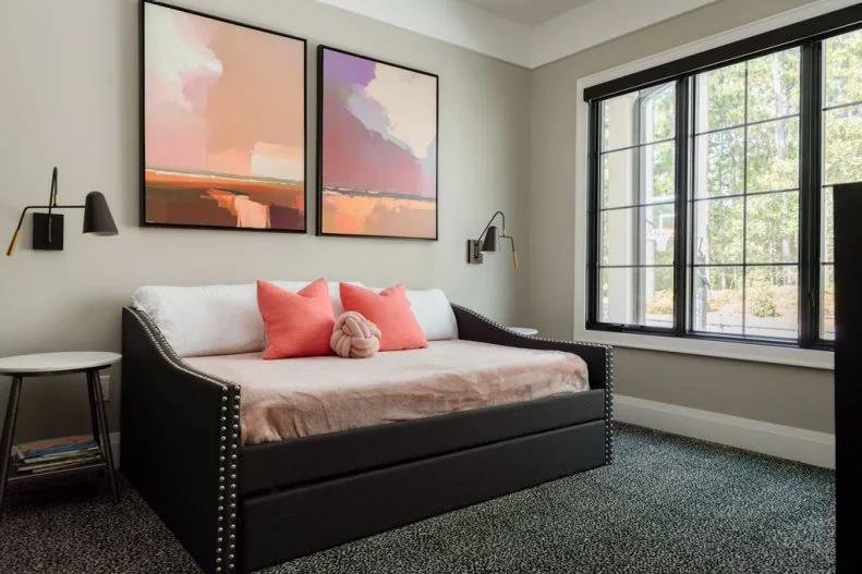 Neutral Bedroom With Orange Pillows