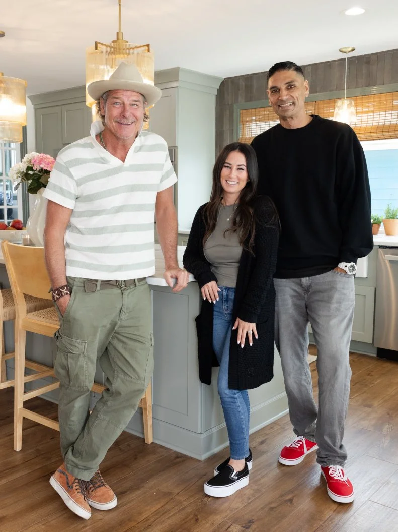 Judges Tristyn and Kamohai Kalama pose with mentor Ty Pennington in the completed kitchen, as seen on Battle on the Beach, Season 5.