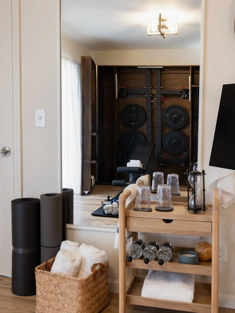 After of Team Sarah Baeumler’s guest bedroom with a Murphy gym and Murphy bed, as seen on Battle on the Beach, Season 5.