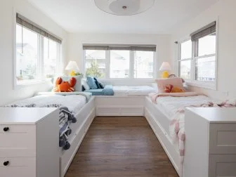 After of Team Ty Pennington’s guest bedroom that includes trundle beds and a lifeguard stand, as seen on Battle on the Beach, Season 5.