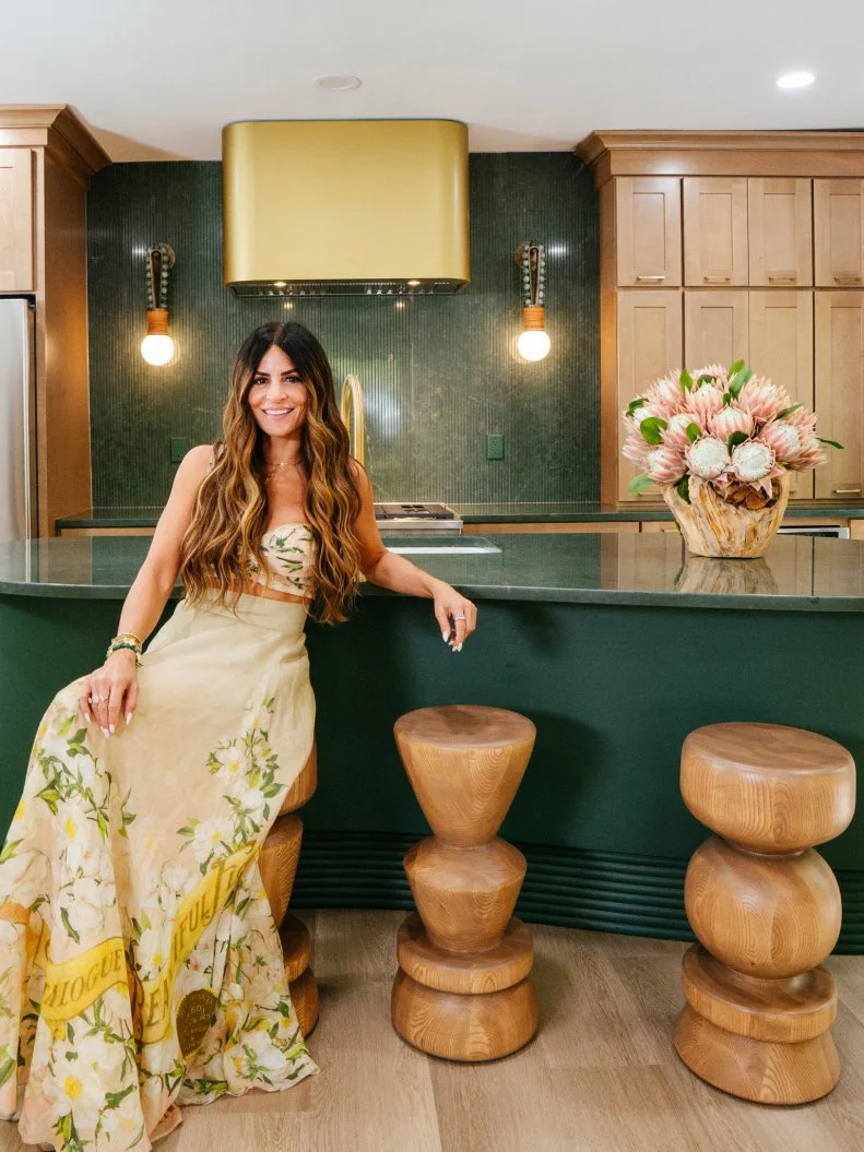 Alison in the new renovated space smiling posed to camera, at the Gaudy Greek Goddess home, as seen on Ugliest House in America, Season 8.