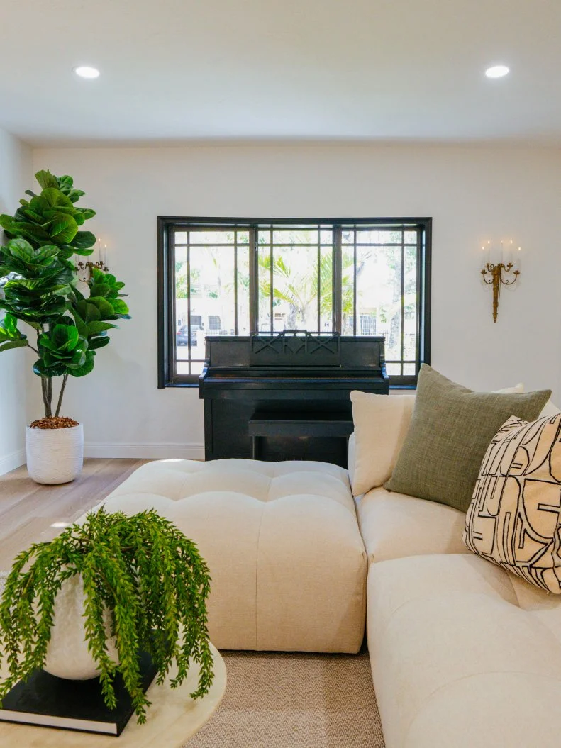 The living room of the Gaudy Greek Goddess home, as seen on Ugliest House in America, Season 8.
